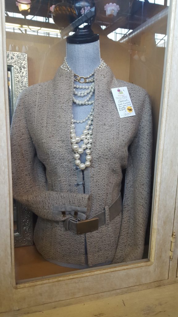 dress with pearl necklace on display