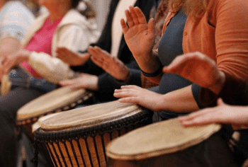 women drumming in breast cancer drum circle