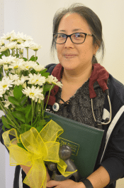Sue Ontoun holdng the Daisy award