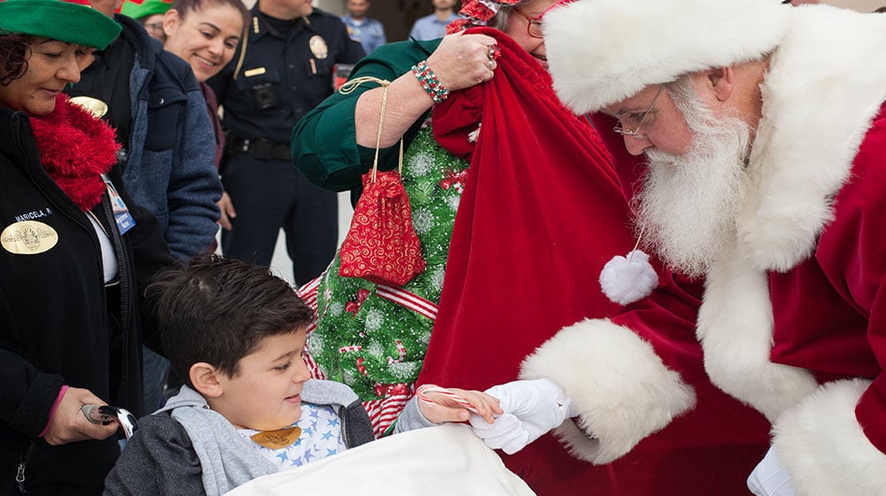 Santa Claus brings holiday joy to Huntington Hospital’s pediatric patients