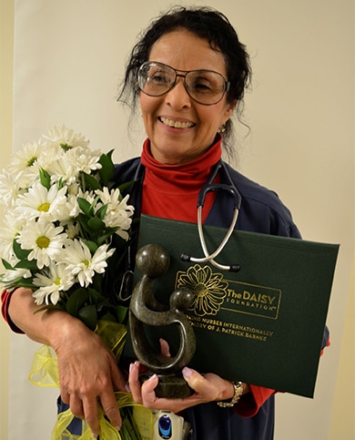 Eileen Castro with the Daisy award