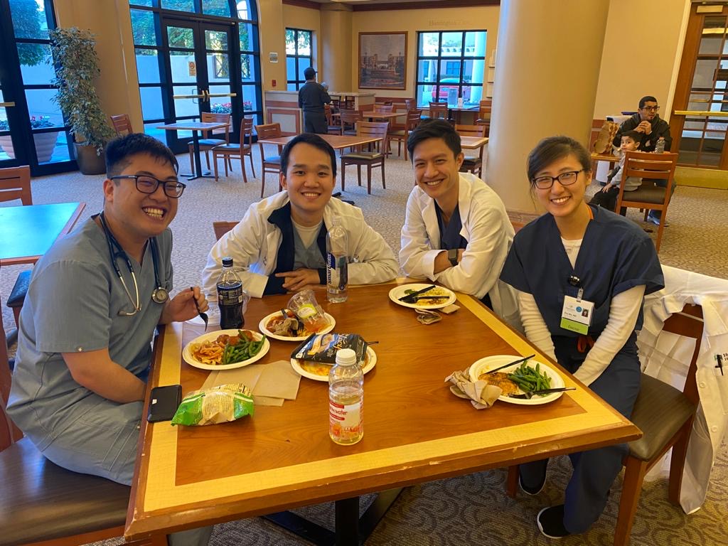Four residents eating together at the Hospital food court