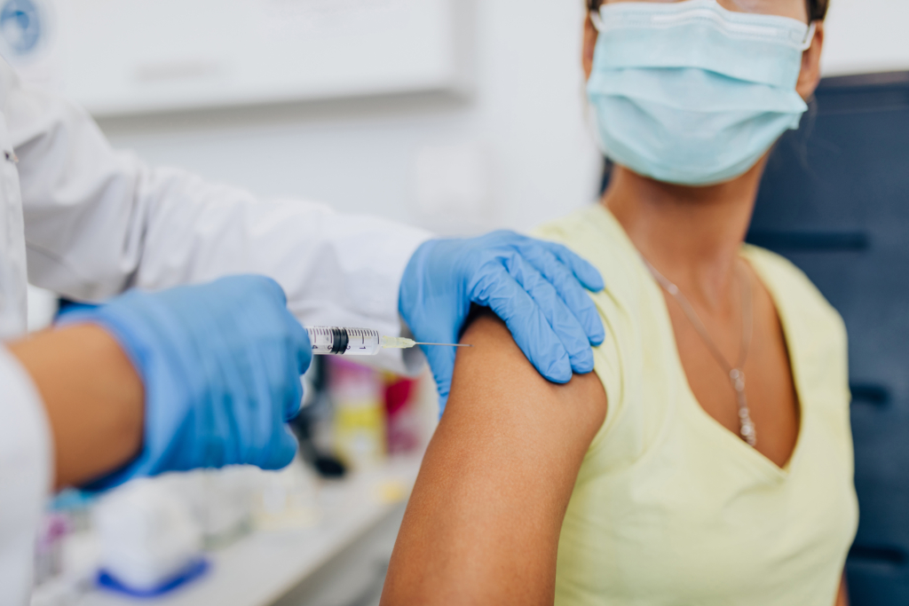 A patient recieveing a flu vaccine shot