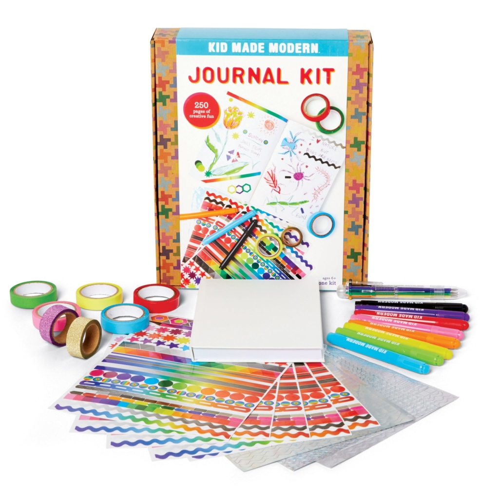 Kid Made Modern Journal kit box and items, including pens, tape, and stickers