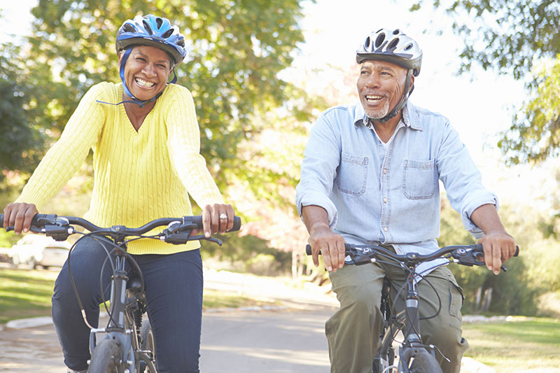 A senior couple enjoying a bike ride