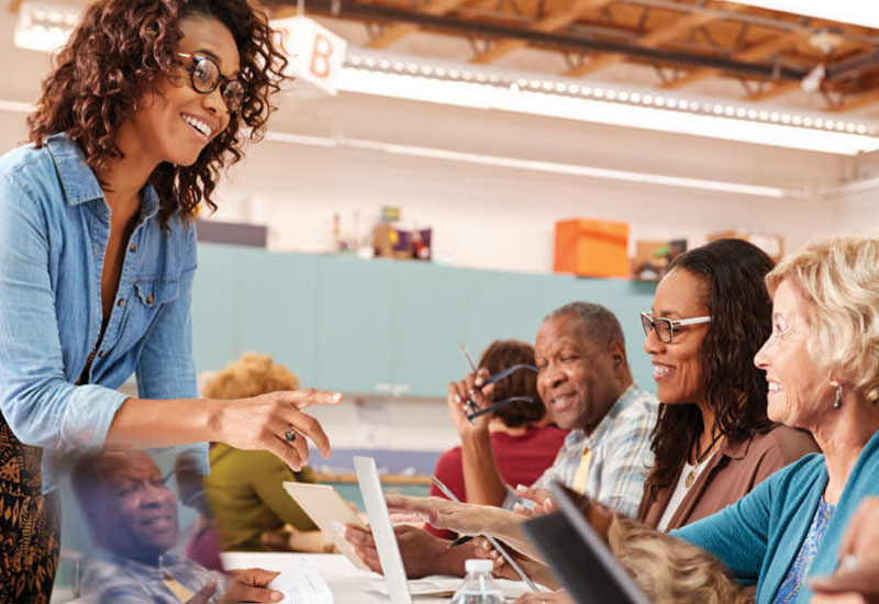 Woman presenting information to a group of seniors