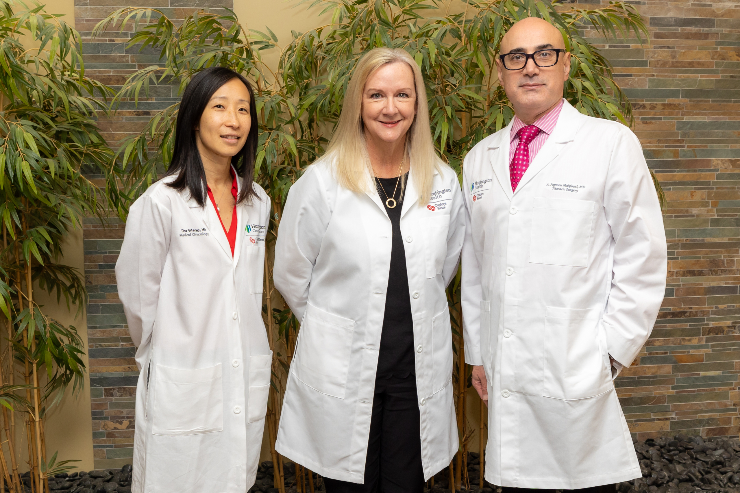 Three lung cancer experts smiling