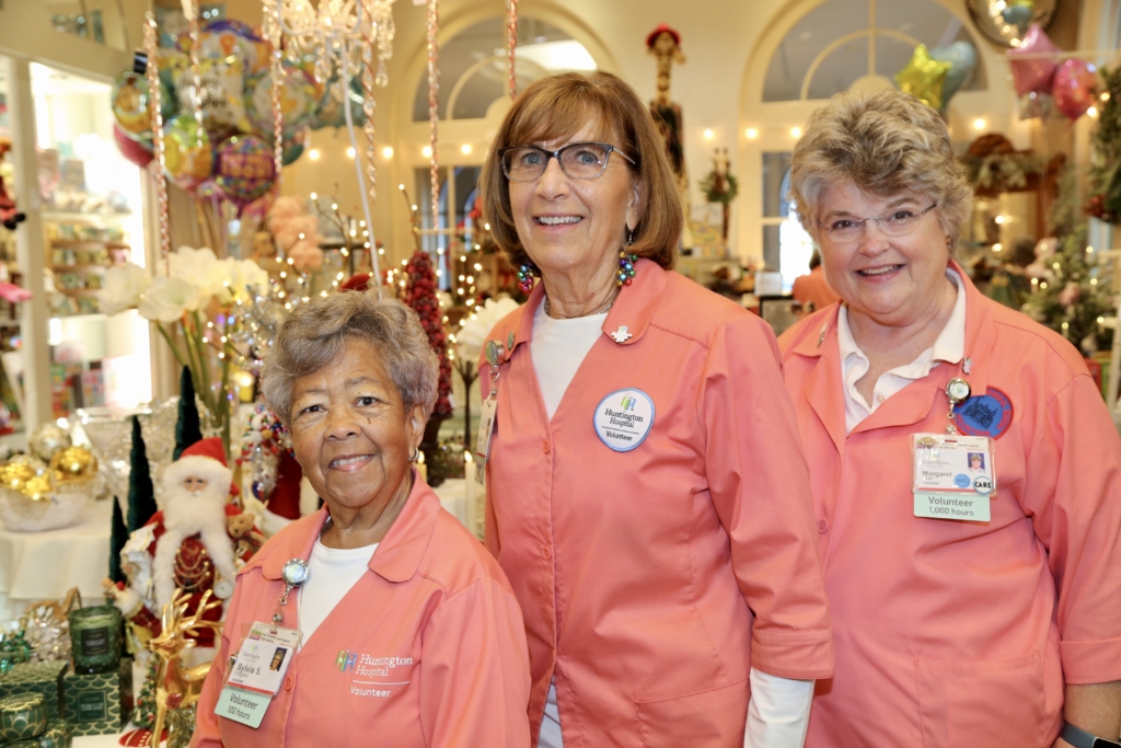 Three volunteers manning the gift shop.