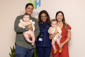 A family (Juan and Celina) with two small children