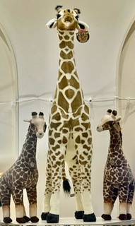 three stuffed giraffes
