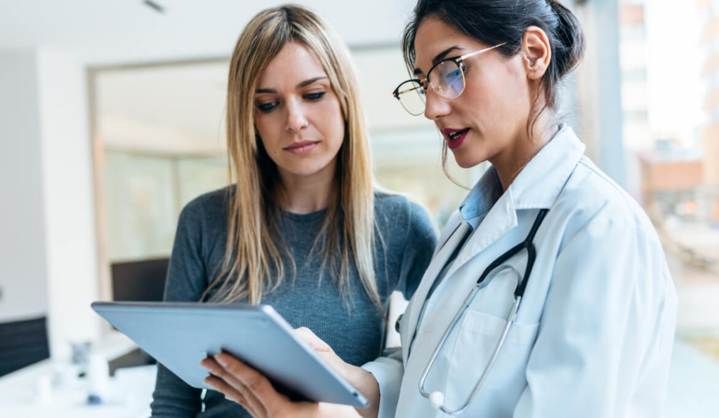 Doctor reviewing report with patient