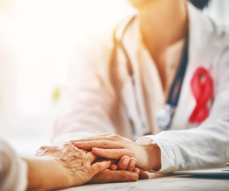 doctor holding the hand of a patient