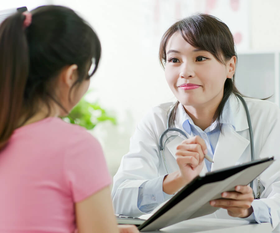 doctor holding documents and pen and showing to patient