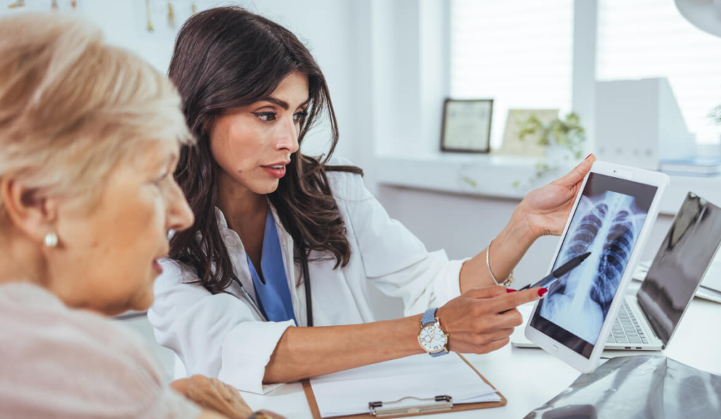doctor and patient looking at xrays