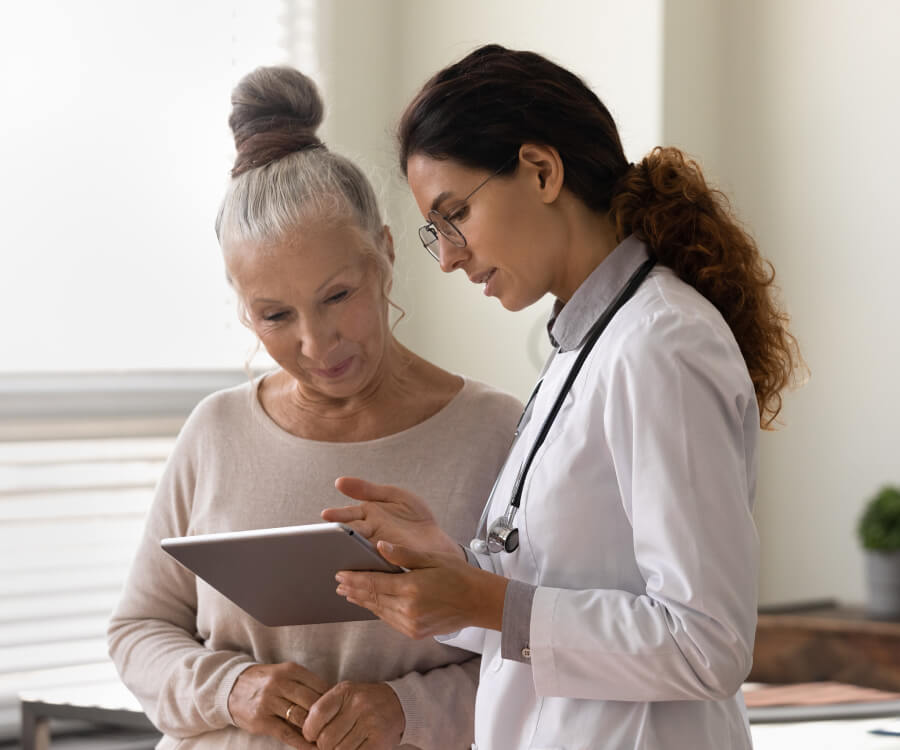 doctor with tablet, talking to patient