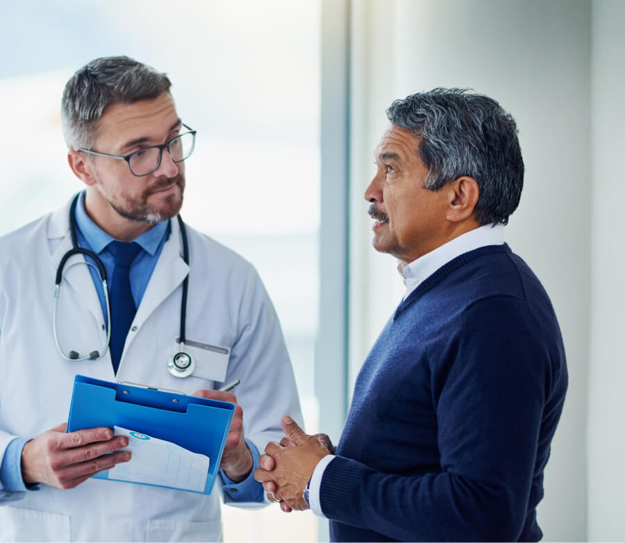 doctor with documents, talking to patient