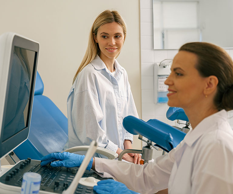 young woman getting screened at gynecologist office