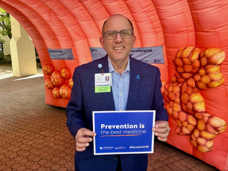 Doctor holding Prevention is the Best Medicine sign